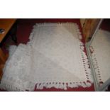 A collection of four matching contemporary cream woollen rugs