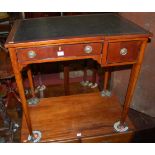 A circa 1900 mahogany and leather inset two drawer writing table, w.76cm