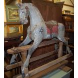 A Victorian childs' dapple-grey rocking horse, raised on pine base (for restoration), length 102cm