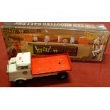 A Triang tinplate pressed steel flatbed truck together with a modern release tin can shooting