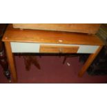 A stained pine and part painted plank top kitchen table, having a single frieze drawer, length