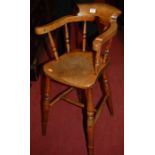 A circa 1900 elm childs' horseshoe stickback high chair