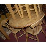 A modern pine circular pedestal kitchen table dia. 103cm; and a set of four modern beech slatback