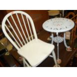 A white painted pierced metal circular small garden table; together with a white painted stickback
