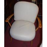 A pair of Ercol light elm stickback open armchairs, each having cream leather cushions