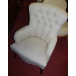 A Laura Ashley floral upholstered armchair raised on turned forelegs, together with a further