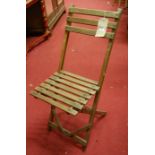 A set of five early 20th century stained and slatted beech folding picnic chairs, by Boston's