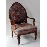 An early Victorian rosewood framed spoonback armchair, later upholstered with padback and