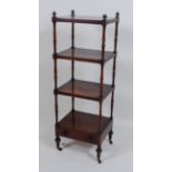 A George IV rosewood four-tier whatnot, on slender turned supports with base drawer, w.48cm, d.38cm,