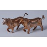 A pair of modern silver bullocks, naturalistically posed, 6.2oz, maker Royal Irish Silver Ltd,