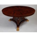 A mahogany centre table, in the Regency taste, the sectional veneered flame mahogany and crossbanded
