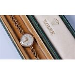 A lady's Rolex Precision wristwatch, the round dial with white face, gilt Arabic quarter hours and