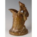 An Austrian Art Nouveau pottery wine pitcher, having Bacchus mask spout, the handle as a maiden