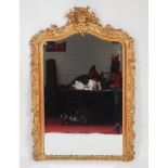 A mid-Victorian giltwood and gesso overmantel mirror, having an arched bevel plate within an 'S'