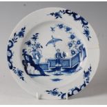 A Lowestoft porcelain blue and white plate, circa 1770, painted with a Chinese lady holding a