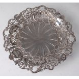 An early 20th century French silver tazza, having raised and pierced Rocaille style rim to a