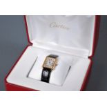 A lady's Cartier 18ct Tank Solo wristwatch, the rectangular white face with black Roman numerals,