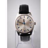 A gentleman's Omega manual wristwatch, the round silvered dial with black an blue baton numerals,