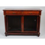 A 19th century rosewood and brass inlaid side cabinet, having a single frieze door over twin