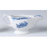 A Lowestoft porcelain relief moulded sauceboat, underglaze blue decorated in the Natural Sprays