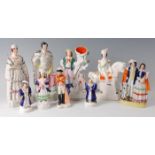 A collection of Victorian Staffordshire figures, to include Campbell upon horseback h.24cm, Shepherd