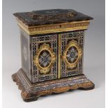 A Victorian papier-mâché and mother of pearl inlaid lady's needlework cabinet, the shaped hinged