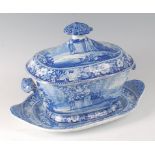 A mid-19th century blue and white printed soup tureen and cover on stand, decorated in the Hop-