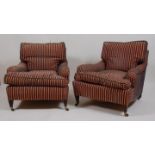 A pair of circa 1900 Howard style mahogany framed armchairs, each upholstered in a striped velour