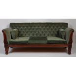 A Victorian rosewood showframe and green dralon buttonback upholstered three-seater sofa, on tulip