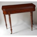 A Regency mahogany tea table, the D-shaped ebony strung and crossbanded fold-over top on double rear
