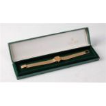 A lady's 9ct gold Rolex Precision wristwatch, the rectangular case with baton numerals, 17mm wide,