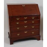 A George III mahogany bureau, the hinged fall revealing a fitted interior above four long