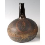 A circa 1700 Dutch commemorative painted onion wine bottle, having painted portrait reserve of