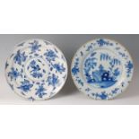 An 18th century Dutch Delft charger, underglaze blue decorated with floral sprays, dia.34cm (glazing