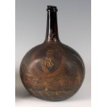 A circa 1700 Dutch commemorative painted onion wine bottle, having painted portrait reserve of