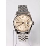 A gentleman's Rolex Oyster Perpetual Datejust wristwatch, the champagne dial with baton numerals,