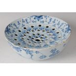 A mid-18th century English Delft colander bowl, having pierced interior, the whole underglaze blue
