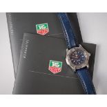 A lady's Tag Heuer 2000 series Professional quartz wristwatch, the blue dial with baton numerals,