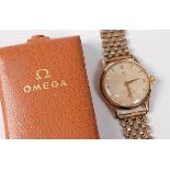 A mid 20th century gentlemans 9ct Omega wristwatch, the round champagne dial with Arabic and baton