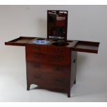 An early 19th century mahogany and satinwood strung gentleman's washstand, the top opening to reveal