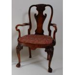 A walnut and figured walnut elbow chair, in the early 18th century style, circa 1900, having a