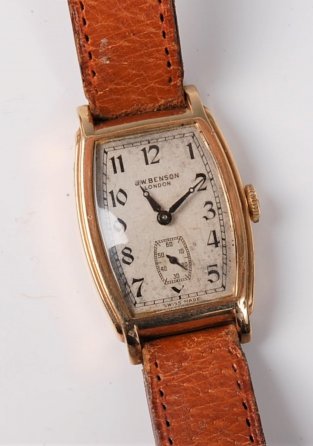 A gentleman's mid 20th century 9ct gold wristwatch by J W Benson, the white dial with black Arabic