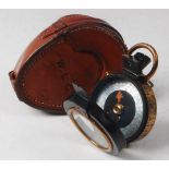 A WW I period private purchase brass and lacquered cased marching compass having a mother of pearl