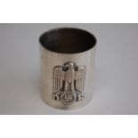 A German silver napkin ring having relief eagle and swastika emblem, stamped 900 and numbered 242.