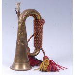 A Boosey & Hawkes Ltd brass military bugle with broad arrow stamp and dated 1960, 29cm.