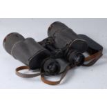 A pair of WW II German Dienstglas 10 x 50 binoculars no. 2209628 with bakelite lens covers.