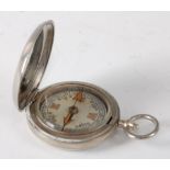 A WW I military issue nickel cased pocket compass stamped W.F. Holmes Birmingham VI 42931 and