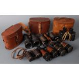 A pair WW I lacquered brass and leather clad binoculars stamped Mk V SP 58014 in an associated