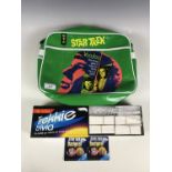 A Star Trek satchel together with a game and badges