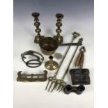 Sundry brass ware including a pair of candlesticks, a pan and toasting forks etc